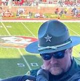 Photo Of Florida Deputy At Football Game Turns Heads, When You Zoom Out You’ll Realize Why