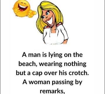 A man is lying on the beach, wearing nothing but a cap over his crotch