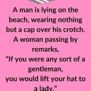 A man is lying on the beach..